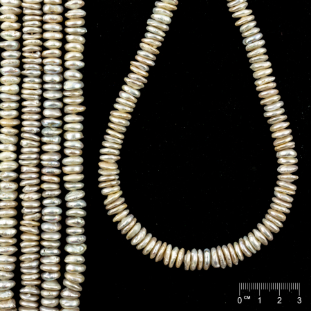 Rang Perles de culture d'eau douce blanches rondelles avec noyau